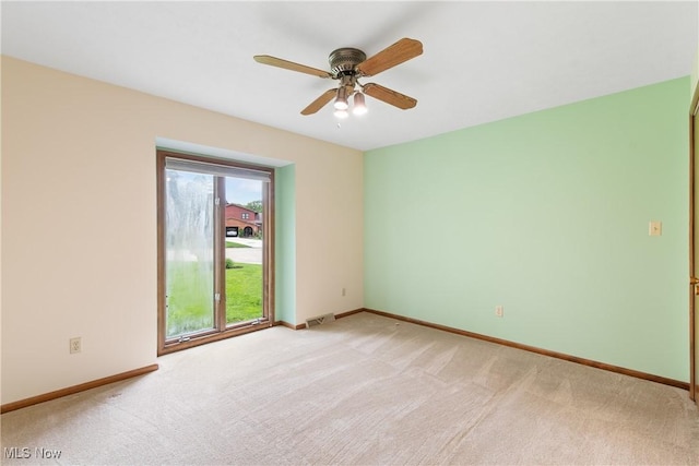 3751 Muirfield Dr, Uniontown, OH 44685 - unfurnished room with light carpet, ceiling fan, and baseboards