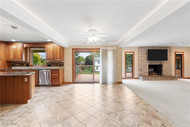 3751 Muirfield Dr, Uniontown, OH 44685 - kitchen with stainless steel dishwasher, plenty of natural light, baseboards, and recessed lighting