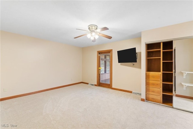 3751 Muirfield Dr, Uniontown, OH 44685 - empty room featuring carpet floors, a ceiling fan, and baseboards