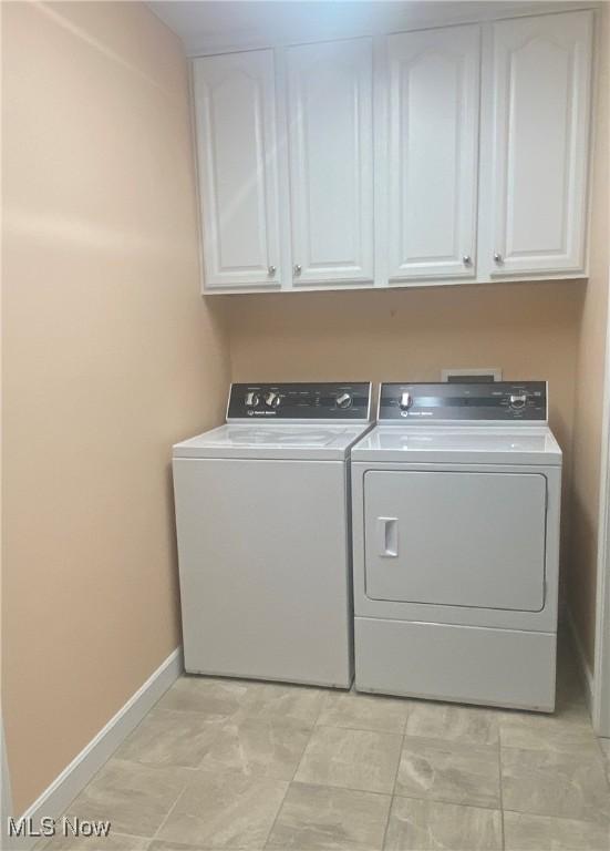 3751 Muirfield Dr, Uniontown, OH 44685 - laundry area with independent washer and dryer, cabinet space, and baseboards