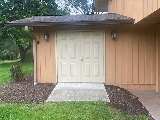 3751 Muirfield Dr, Uniontown, OH 44685 - doorway to property with roof with shingles