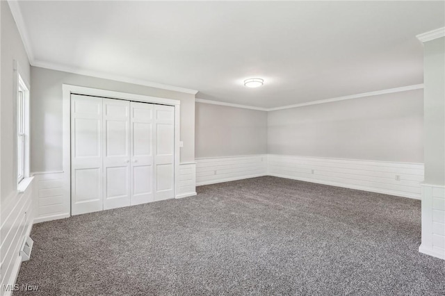 7558 E Parkside Dr, Boardman, OH 44512 - unfurnished bedroom with ornamental molding, wainscoting, carpet, and a closet