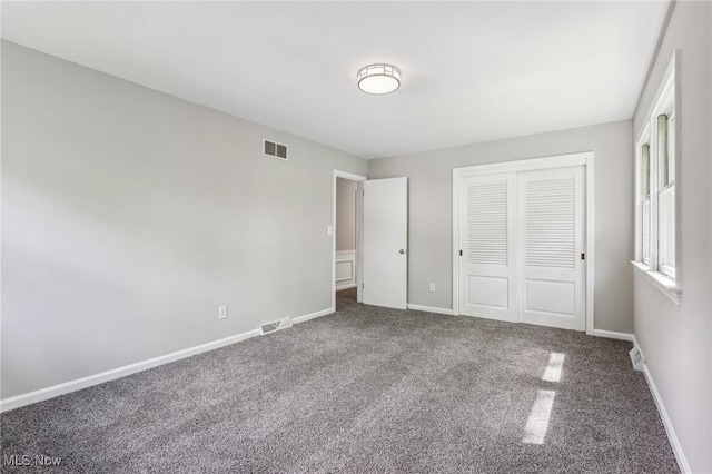 7558 E Parkside Dr, Boardman, OH 44512 - unfurnished bedroom with carpet floors, a closet, and baseboards