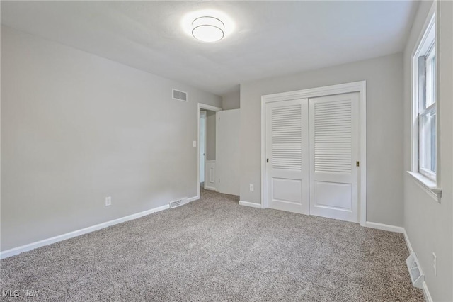 7558 E Parkside Dr, Boardman, OH 44512 - unfurnished bedroom with carpet floors, a closet, and baseboards