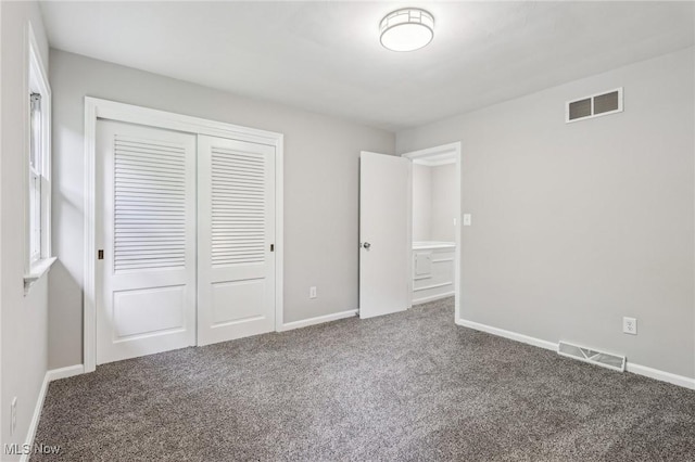 7558 E Parkside Dr, Boardman, OH 44512 - unfurnished bedroom with carpet, a closet, and baseboards