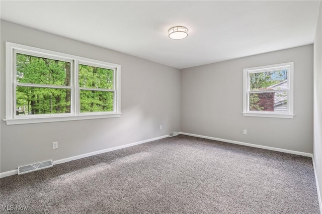 7558 E Parkside Dr, Boardman, OH 44512 - empty room with healthy amount of natural light and carpet floors