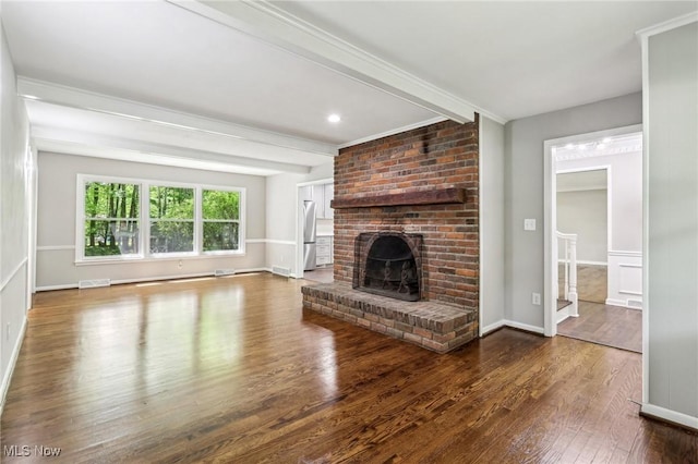 7558 E Parkside Dr, Boardman, OH 44512 - unfurnished living room with beamed ceiling, wood finished floors, a fireplace, and baseboards
