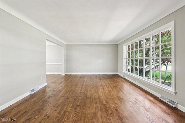 7558 E Parkside Dr, Boardman, OH 44512 - empty room featuring dark wood-style flooring and baseboards