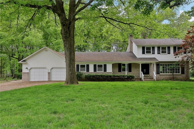7558 E Parkside Dr, Boardman, OH 44512 - traditional-style house featuring dirt driveway, a front lawn, a chimney, and an attached garage