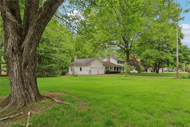 7558 E Parkside Dr, Boardman, OH 44512 - view of green lawn featuring an attached garage
