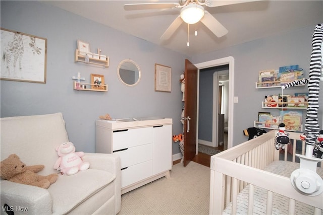 6892 Glenwood Ave, Youngstown, OH 44512 - bedroom with light colored carpet and ceiling fan