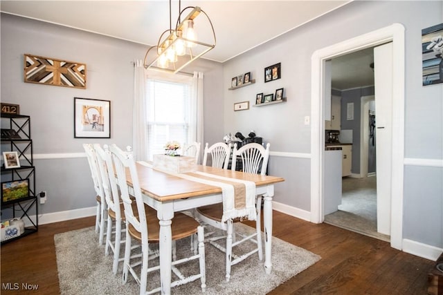 6892 Glenwood Ave, Youngstown, OH 44512 - dining area with wood finished floors, baseboards, and a chandelier