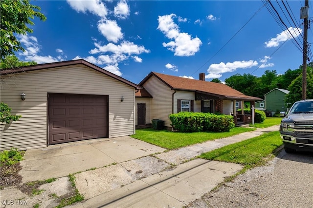 106 High St, Bloomingdale, OH 43910 - ranch-style house with concrete driveway, a front yard, and an attached garage