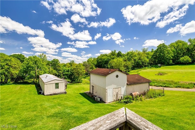 106 High St, Bloomingdale, OH 43910 - view of green lawn featuring an outbuilding