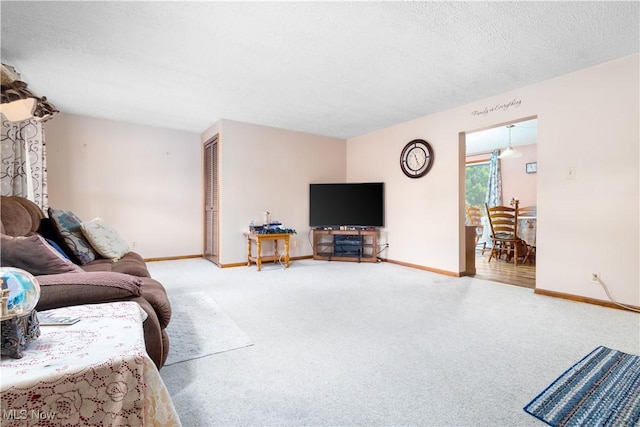 106 High St, Bloomingdale, OH 43910 - living area with carpet floors, baseboards, and a textured ceiling
