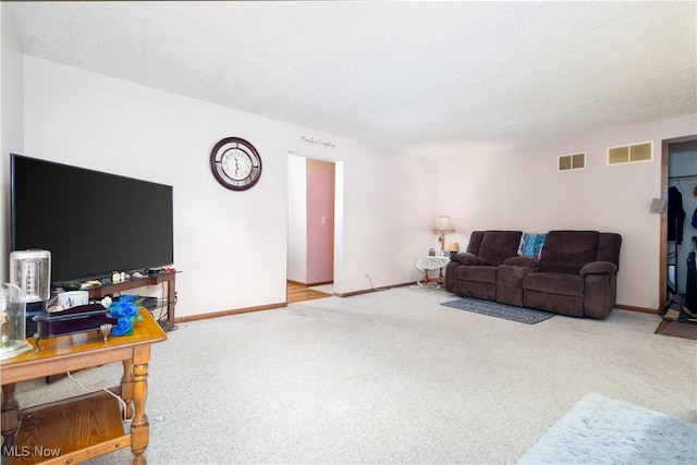 106 High St, Bloomingdale, OH 43910 - carpeted living area featuring baseboards and a textured ceiling