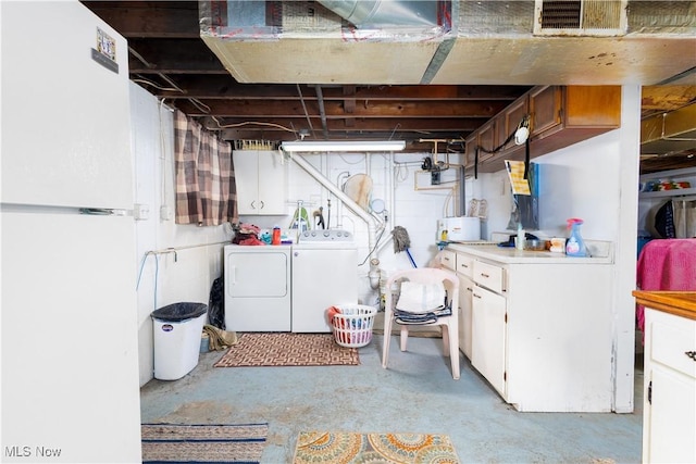 106 High St, Bloomingdale, OH 43910 - unfinished basement featuring washer and clothes dryer