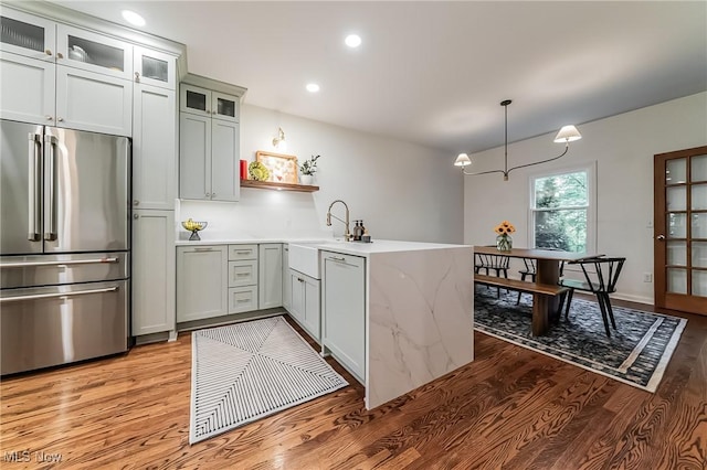 8698 Chase Dr, Chagrin Falls, OH 44023 - kitchen with high quality fridge, light wood-style flooring, open shelves, a sink, and recessed lighting