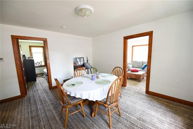 3000AND2996 Kemble Ave, Coventry, OH 44319 - carpeted dining space with baseboards