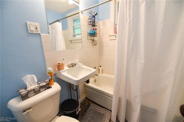3000AND2996 Kemble Ave, Coventry, OH 44319 - full bathroom featuring toilet, shower / bath combo with shower curtain, decorative backsplash, and tile walls
