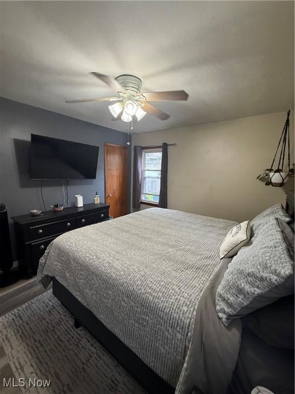 7511 Jameson Rd, Parma, OH 44129 - bedroom with wood finished floors and ceiling fan