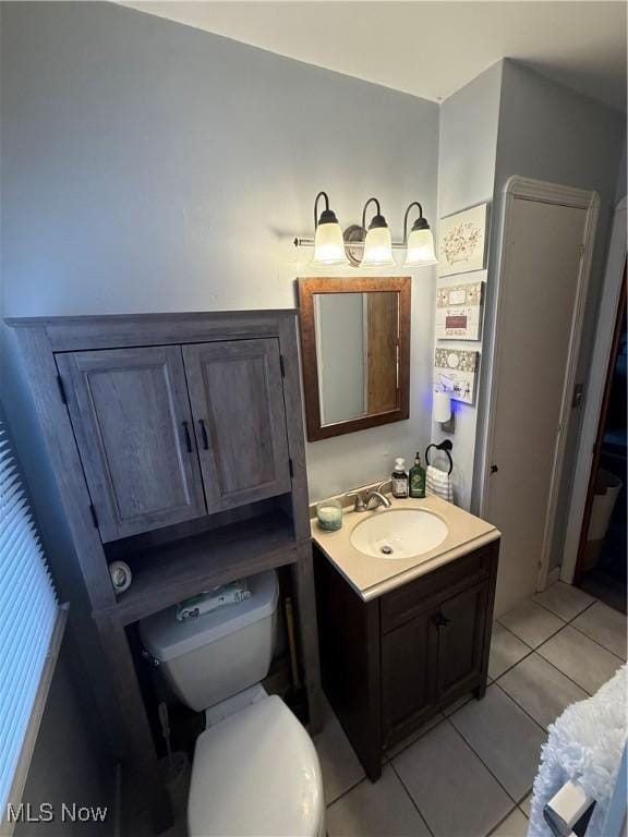 7511 Jameson Rd, Parma, OH 44129 - bathroom with vanity, toilet, and tile patterned flooring