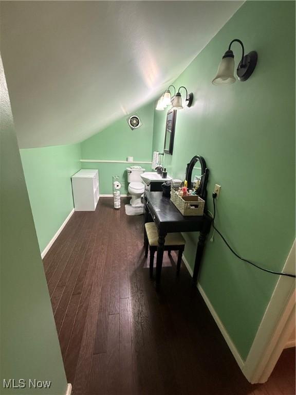 7511 Jameson Rd, Parma, OH 44129 - office space featuring lofted ceiling, wood finished floors, and baseboards