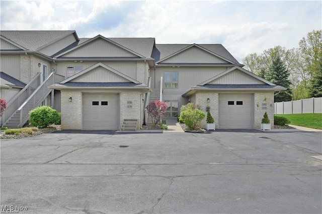 578 Lakeview Blvd, Lake Milton, OH 44429 - multi unit property featuring brick siding, driveway, and a garage