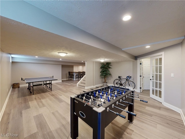 8836 Shetland Ct, Kirtland, OH 44094 - playroom featuring wood finished floors, baseboards, a textured ceiling, and recessed lighting