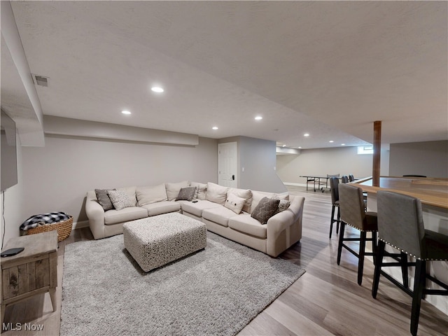 8836 Shetland Ct, Kirtland, OH 44094 - living area featuring wood finished floors, recessed lighting, and baseboards