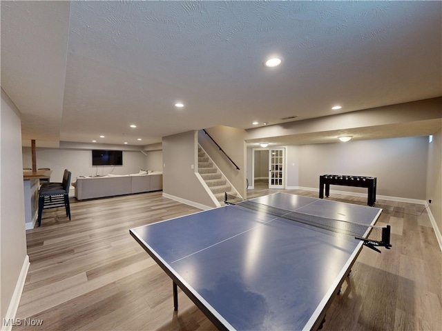8836 Shetland Ct, Kirtland, OH 44094 - rec room with baseboards, light wood-style floors, and recessed lighting
