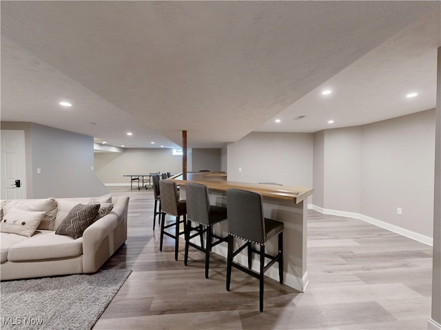 8836 Shetland Ct, Kirtland, OH 44094 - bar area featuring light wood-type flooring, baseboards, and recessed lighting
