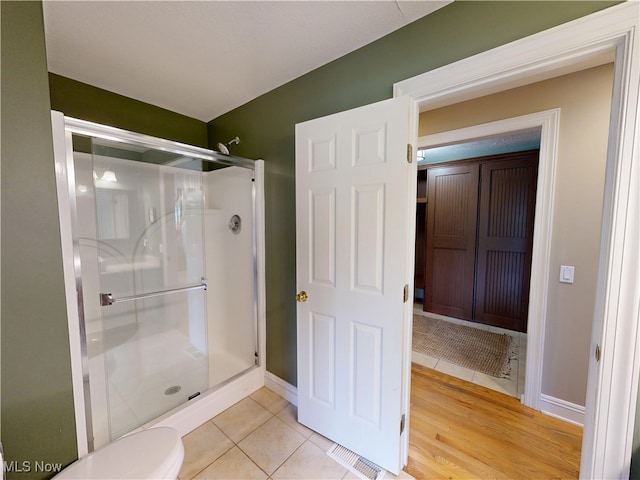 8836 Shetland Ct, Kirtland, OH 44094 - full bath with a shower stall, tile patterned floors, baseboards, and toilet