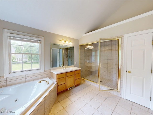8836 Shetland Ct, Kirtland, OH 44094 - bathroom featuring lofted ceiling, vanity, a stall shower, a whirlpool tub, and tile patterned floors