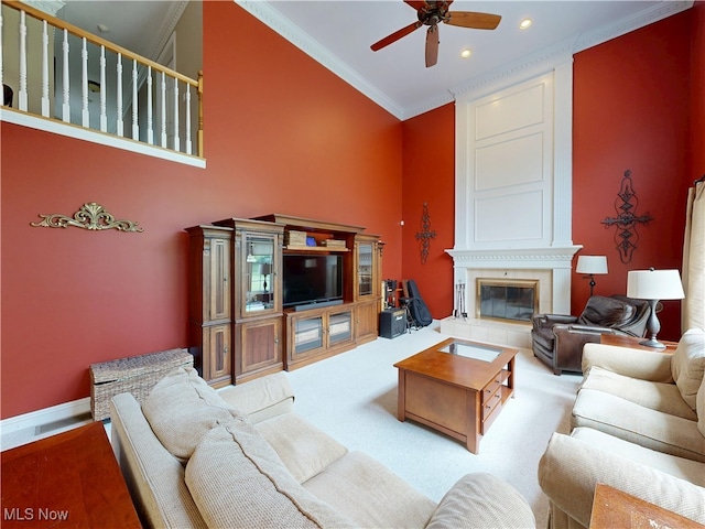 8836 Shetland Ct, Kirtland, OH 44094 - living room with crown molding, a ceiling fan, a fireplace, recessed lighting, and carpet flooring