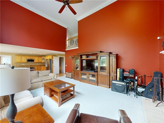 8836 Shetland Ct, Kirtland, OH 44094 - living area with crown molding, a high ceiling, a ceiling fan, and light colored carpet