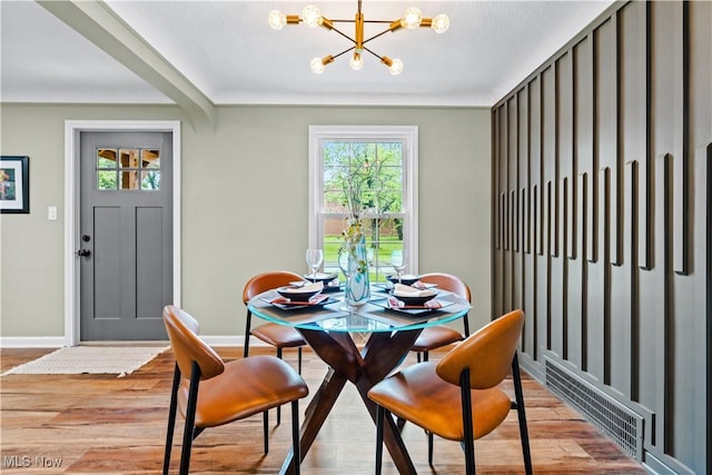 4493 Golfway Rd, South Euclid, OH 44121 - dining space with a chandelier, baseboards, and plenty of natural light