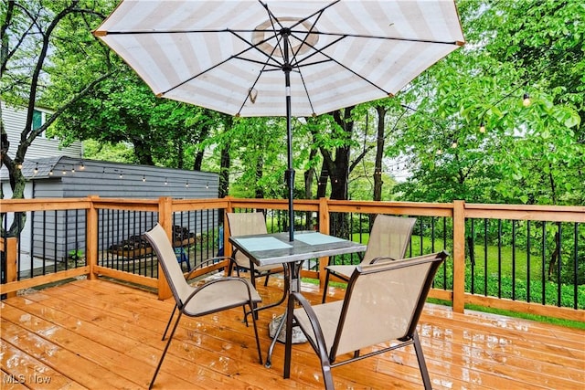 4493 Golfway Rd, South Euclid, OH 44121 - deck featuring outdoor dining space and view of scattered trees
