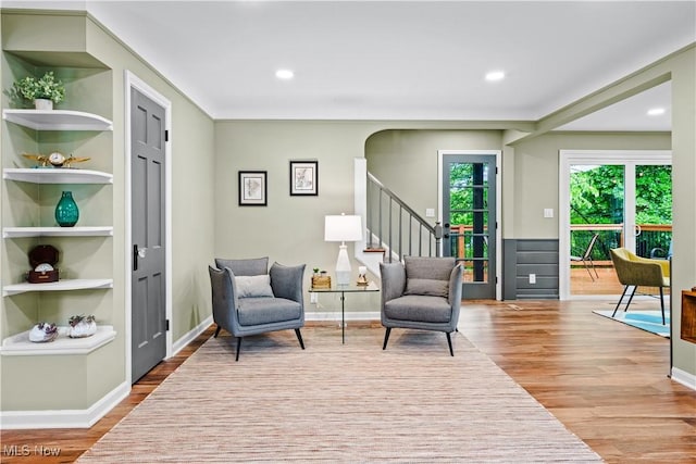 4493 Golfway Rd, South Euclid, OH 44121 - living area featuring wood finished floors, stairs, built in shelves, recessed lighting, and baseboards