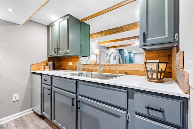4493 Golfway Rd, South Euclid, OH 44121 - kitchen with a sink, light wood-style flooring, gray cabinetry, baseboards, and light stone countertops