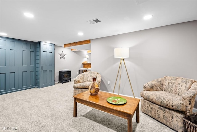 4493 Golfway Rd, South Euclid, OH 44121 - living area featuring a wood stove, carpet flooring, recessed lighting, and baseboards