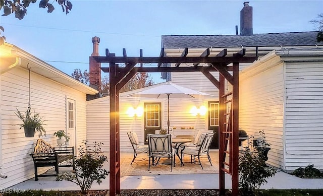 131 N Walnut St, Ravenna, OH 44266 - view of patio featuring a pergola