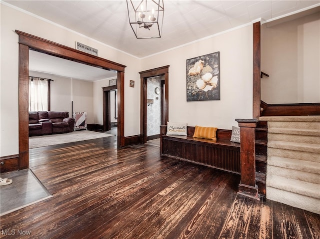 154 Montgomery Blvd, New Concord, OH 43762 - foyer entrance with wood-type flooring, ornamental molding, a chandelier, baseboards, and stairs