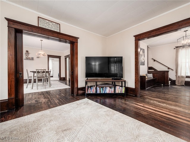 154 Montgomery Blvd, New Concord, OH 43762 - living area with hardwood / wood-style flooring, a chandelier, ornamental molding, stairs, and baseboards