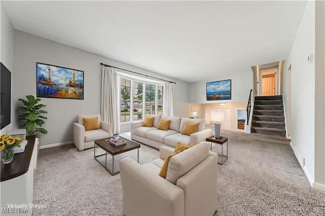 21517 Nottingham Dr, Fairview Park, OH 44126 - living area featuring light carpet, stairway, and baseboards