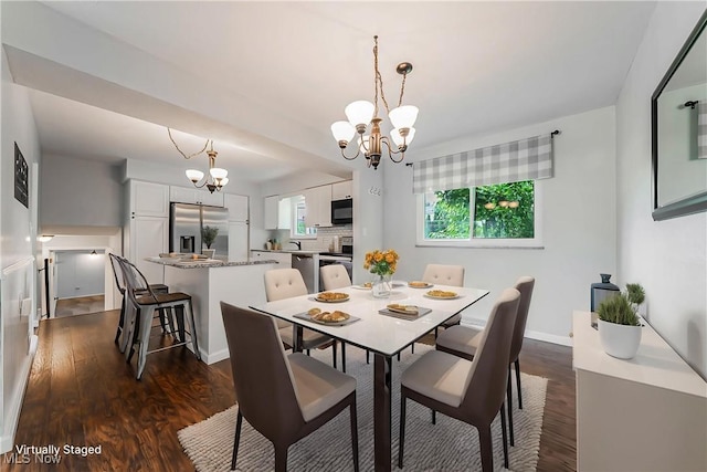 21517 Nottingham Dr, Fairview Park, OH 44126 - dining room featuring a chandelier, dark wood-type flooring, and baseboards