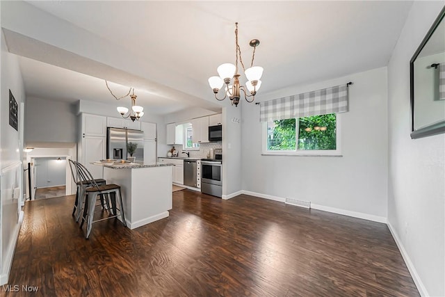 21517 Nottingham Dr, Fairview Park, OH 44126 - kitchen featuring stainless steel appliances, a chandelier, plenty of natural light, and white cabinets