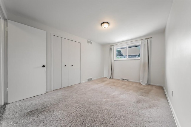 21517 Nottingham Dr, Fairview Park, OH 44126 - unfurnished bedroom with carpet flooring, a closet, and baseboards