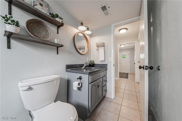 21517 Nottingham Dr, Fairview Park, OH 44126 - bathroom featuring tile patterned floors, toilet, and vanity