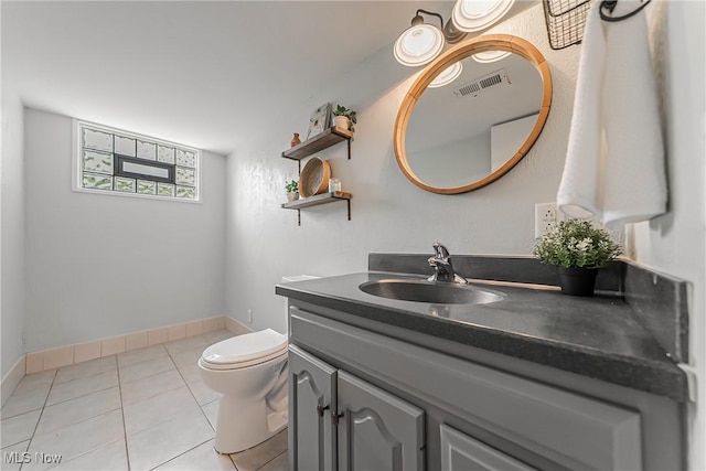21517 Nottingham Dr, Fairview Park, OH 44126 - bathroom with vanity, tile patterned floors, toilet, and baseboards